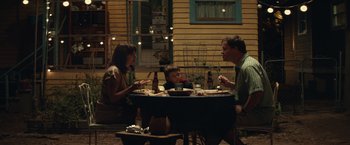 Movie still from “Timmy Failure: Mistakes Were Made” (2020), directed by Tom McCarthy – Three people sitting at a table with food on top of it; Medium shot, High angle