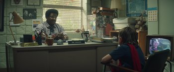 Movie still from “Timmy Failure: Mistakes Were Made” (2020), directed by Tom McCarthy – A man sitting at a table with a child; Medium shot, Over the shoulder angle