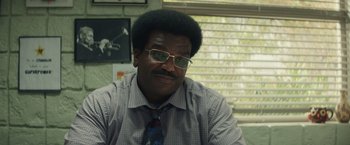 Movie still from “Timmy Failure: Mistakes Were Made” (2020), directed by Tom McCarthy – A man in a shirt and a tie; Close Up shot, Over the shoulder angle