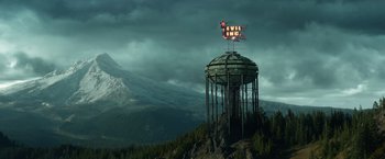 Movie still from “Timmy Failure: Mistakes Were Made” (2020), directed by Tom McCarthy – A tower that has a sign on top of it that says " evil inc "; Extreme Wide shot, Low angle