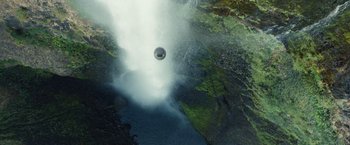 Movie still from “Timmy Failure: Mistakes Were Made” (2020), directed by Tom McCarthy – An aerial view of a waterfall and a pool of water; Extreme Wide shot, Overhead angle