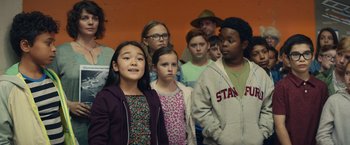 Movie still from “Timmy Failure: Mistakes Were Made” (2020), directed by Tom McCarthy – A group of children standing in front of an orange wall; Medium shot, Low angle