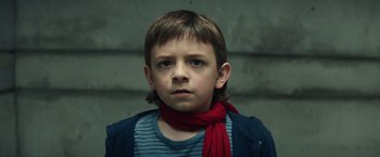 Movie still from “Timmy Failure: Mistakes Were Made” (2020), directed by Tom McCarthy – A young boy with a red scarf around his neck; Close Up shot, Low angle