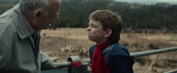 Movie still from “Timmy Failure: Mistakes Were Made” (2020), directed by Tom McCarthy – A boy with a red neck tie looking at a man; Close Up shot, Over the shoulder angle