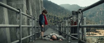 Movie still from “Timmy Failure: Mistakes Were Made” (2020), directed by Tom McCarthy – A man laying on the ground next to a young boy; Wide shot, High angle