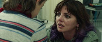 Movie still from “Timmy Failure: Mistakes Were Made” (2020), directed by Tom McCarthy – A woman with purple hair talking to a young boy; Close Up shot, Over the shoulder angle