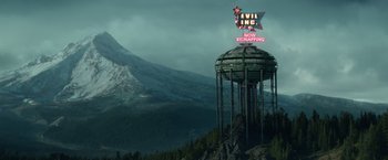 Movie still from “Timmy Failure: Mistakes Were Made” (2020), directed by Tom McCarthy – A tower that has a sign on top of it; Extreme Wide shot, High angle