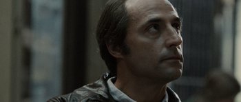 Movie still from “Tinker Tailor Soldier Spy” (2011), directed by Tomas Alfredson – A person looking up at something; Close Up shot, Low angle