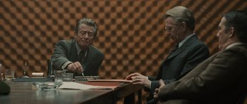 Movie still from “Tinker Tailor Soldier Spy” (2011), directed by Tomas Alfredson – Two men sitting at a table in front of one another; Medium shot, Over the shoulder angle