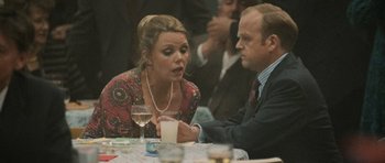 Movie still from “Tinker Tailor Soldier Spy” (2011), directed by Tomas Alfredson – A man and a woman sitting at a dinner table; Medium shot, Over the shoulder angle