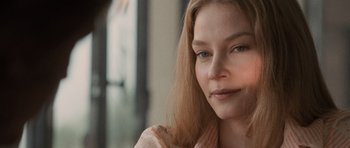 Movie still from “Tinker Tailor Soldier Spy” (2011), directed by Tomas Alfredson – A person with long hair; Close Up shot, Over the shoulder angle