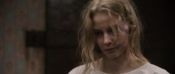 Movie still from “Tinker Tailor Soldier Spy” (2011), directed by Tomas Alfredson – A person with long blonde hair; Close Up shot, Over the shoulder angle