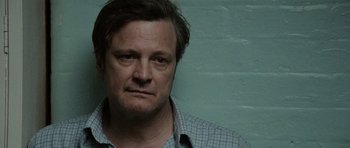 Movie still from “Tinker Tailor Soldier Spy” (2011), directed by Tomas Alfredson – A person wearing a plaid shirt; Close Up shot, Low angle