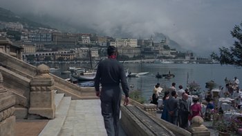 Movie still from “To Catch a Thief” (1955), directed by Alfred Hitchcock – A man walking down the steps of a pier; Extreme Wide shot, High angle