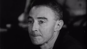 Movie still from “To End All War: Oppenheimer & the Atomic Bomb” (2023), directed by Christopher Cassel – A black - and - white photo of a man's face; Close Up shot, High angle