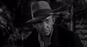 Movie still from “To Kill a Mockingbird” (1962), directed by Robert Mulligan – A man wearing a hat in a black and white photo; Close Up shot, Low angle