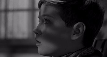 Movie still from “To Kill a Mockingbird” (1962), directed by Robert Mulligan – A young boy is looking into the distance; Close Up shot, High angle