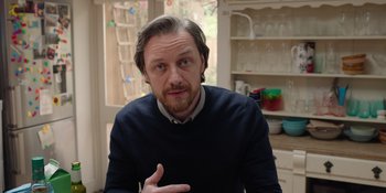 Movie still from “Together” (2021), directed by Justin Martin – A person in a room near a window; Medium shot, Over the shoulder angle