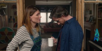 Movie still from “Together” (2021), directed by Justin Martin – A man and a woman holding a coffee cup; Medium shot, Over the shoulder angle