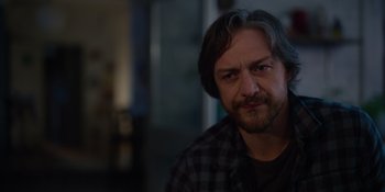 Movie still from “Together” (2021), directed by Justin Martin – A person wearing a shirt; Close Up shot, Over the shoulder angle
