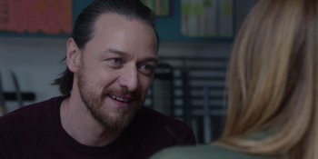 Movie still from “Together” (2021), directed by Justin Martin – A person sitting in a room; Close Up shot, Over the shoulder angle