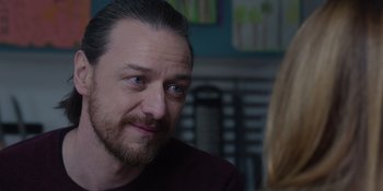 Movie still from “Together” (2021), directed by Justin Martin – A person sitting in a room; Close Up shot, Over the shoulder angle