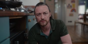 Movie still from “Together” (2021), directed by Justin Martin – A person with long hair and a beard; Close Up shot, Low angle