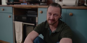 Movie still from “Together” (2021), directed by Justin Martin – A person sitting in a room; Close Up shot, Over the shoulder angle