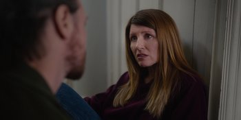 Movie still from “Together” (2021), directed by Justin Martin – A woman talking to a man in front of a mirror; Close Up shot, Over the shoulder angle