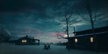 Movie still from “Togo” (2019), directed by Ericson Core – An empty picnic table in the snow at dusk; Extreme Wide shot, Low angle