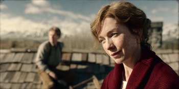 Movie still from “Togo” (2019), directed by Ericson Core – A woman in a red sweater and a man in a red sweater; Close Up shot, Over the shoulder angle