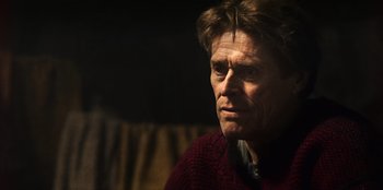 Movie still from “Togo” (2019), directed by Ericson Core – A person wearing a sweater; Close Up shot, Low angle