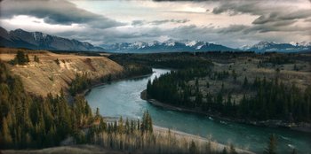 Movie still from “Togo” (2019), directed by Ericson Core – A view of a body of water with mountains in the background; Extreme Wide shot, High angle