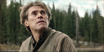 Movie still from “Togo” (2019), directed by Ericson Core – A person looking up at the sky; Close Up shot, Low angle