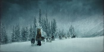 Movie still from “Togo” (2019), directed by Ericson Core – A person in a dog sled in the snow; Extreme Wide shot, Low angle
