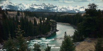 Movie still from “Togo” (2019), directed by Ericson Core – A view of a river with a mountain in the background; Extreme Wide shot, High angle