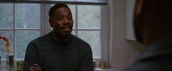 Movie still from “Without Remorse” (2021), directed by Stefano Sollima – A man sitting in front of a window in a room; Close Up shot, Over the shoulder angle