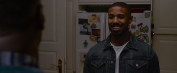 Movie still from “Without Remorse” (2021), directed by Stefano Sollima – A man standing in front of a refrigerator in a kitchen; Close Up shot, Over the shoulder angle