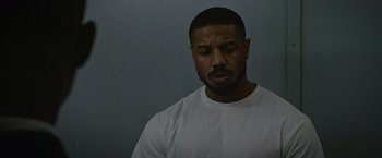 Movie still from “Without Remorse” (2021), directed by Stefano Sollima – A person with his eyes closed; Close Up shot, Low angle