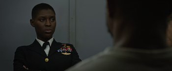 Movie still from “Without Remorse” (2021), directed by Stefano Sollima – A man in a uniform looking at himself in the mirror; Close Up shot, Over the shoulder angle