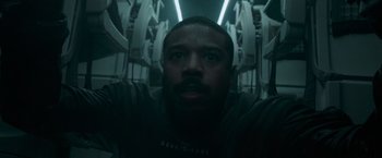 Movie still from “Without Remorse” (2021), directed by Stefano Sollima – A person in a tunnel; Close Up shot, Overhead angle