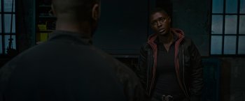 Movie still from “Without Remorse” (2021), directed by Stefano Sollima – A man standing in front of a mirror looking at himself in the mirror; Medium shot, Over the shoulder angle