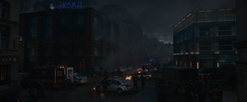 Movie still from “Without Remorse” (2021), directed by Stefano Sollima – A group of police officers standing on the side of a road; Extreme Wide shot, High angle