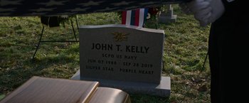 Movie still from “Without Remorse” (2021), directed by Stefano Sollima – A headstone for john t; Extreme Close Up shot, Over the shoulder angle