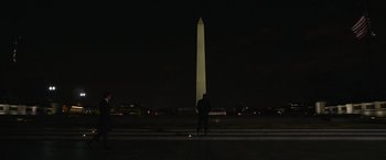 Movie still from “Without Remorse” (2021), directed by Stefano Sollima – A man standing in front of the washington monument at night; Extreme Wide shot, Low angle