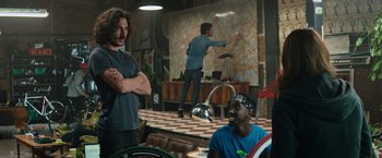 Movie still from “Tomb Raider” (2018), directed by Roar Uthaug – Two men are sitting in front of each other in a room; Medium shot, Over the shoulder angle