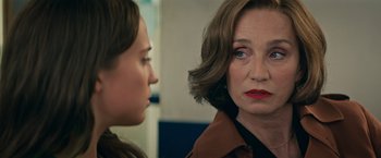 Movie still from “Tomb Raider” (2018), directed by Roar Uthaug – A woman is looking at another woman in a room; Close Up shot, Over the shoulder angle