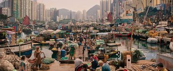 Movie still from “Tomb Raider” (2018), directed by Roar Uthaug – A group of people standing on top of a dock; Extreme Wide shot, High angle