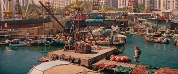 Movie still from “Tomb Raider” (2018), directed by Roar Uthaug – A boat dock with many boats in the water; Extreme Wide shot, High angle