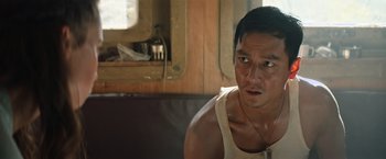 Movie still from “Tomb Raider” (2018), directed by Roar Uthaug – A person sitting in front of a mirror; Close Up shot, Low angle